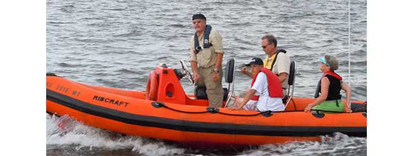 Students and instructor in boat during class at World Wide Marine Training. 